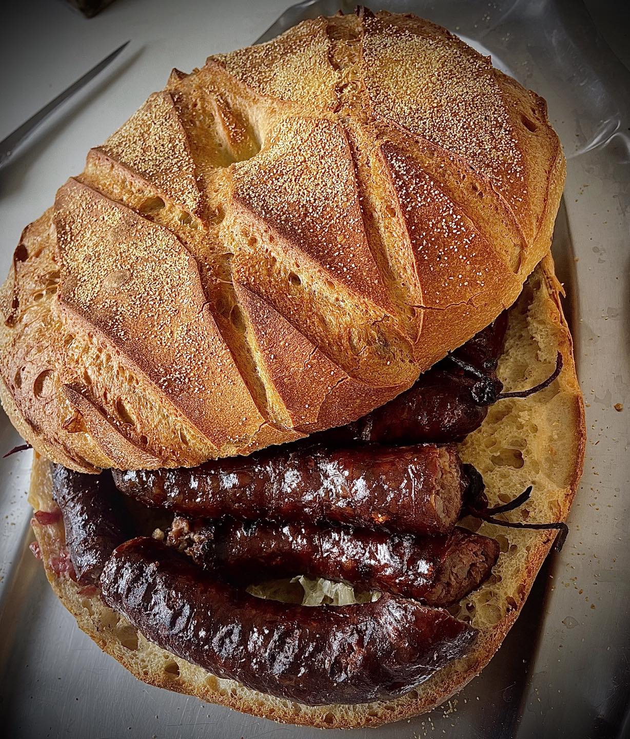 Manger un figatellu corse Visite gourmande Bastia, Guide Bastia, Visiter Bastia, Visite guidée Bastia, Guide Corse